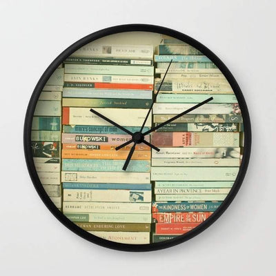 Bookworm Wall clock with black frame featuring books as the background design, 10 inches in diameter.