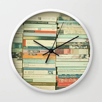 Bookworm Wall clock with white frame featuring book-themed design and black hands against a colorful book background.